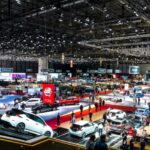 Advanced AI-powered autonomous vehicle navigating smart city infrastructure with sensor fusion technology, V2X communication networks, and intelligent traffic management systems in 2026